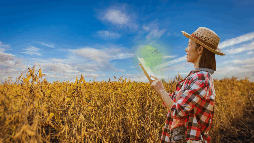 Mulher usando tablet para gerenciar produção de sementes em lavoura de soja com tecnologia Hisower